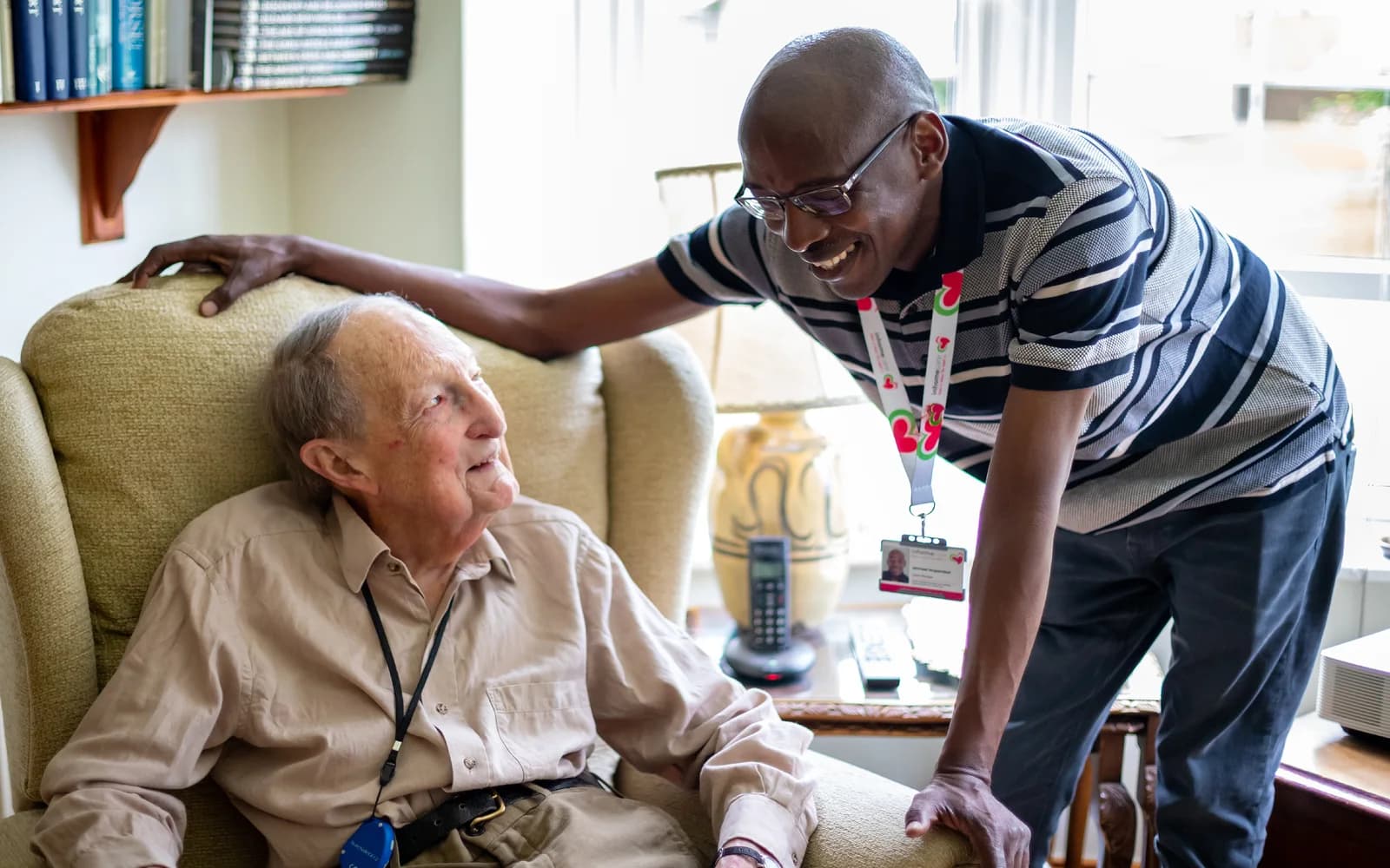 Male carer looking at client